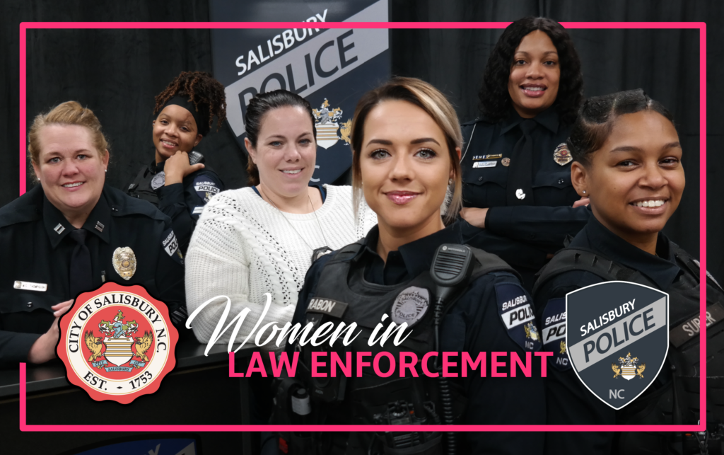 Celebrate Women's History month: Group of female police officers in uniform posed inf front of a firetruck, smiling at camera.